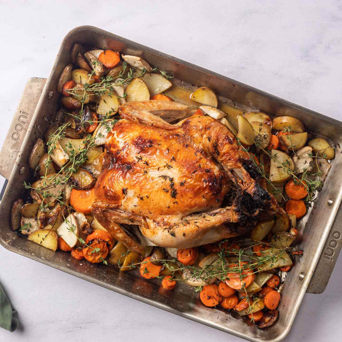 Poulet rôti au charbon de bois et ses légumes racines