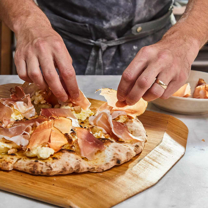 Pizza Crostini with Ricotta, Speck and Marcona Almonds